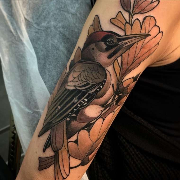 woodpecker feather tattoo