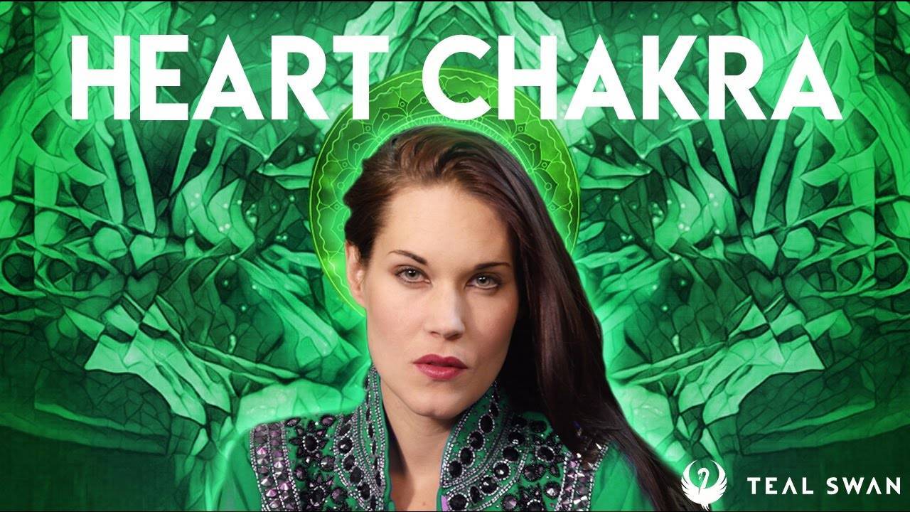 Heart chakra meditation pose showing a woman in peaceful meditation with green energy around heart center