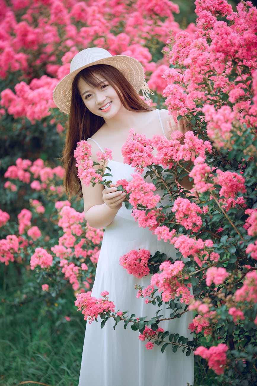 woman behind myrtle tree