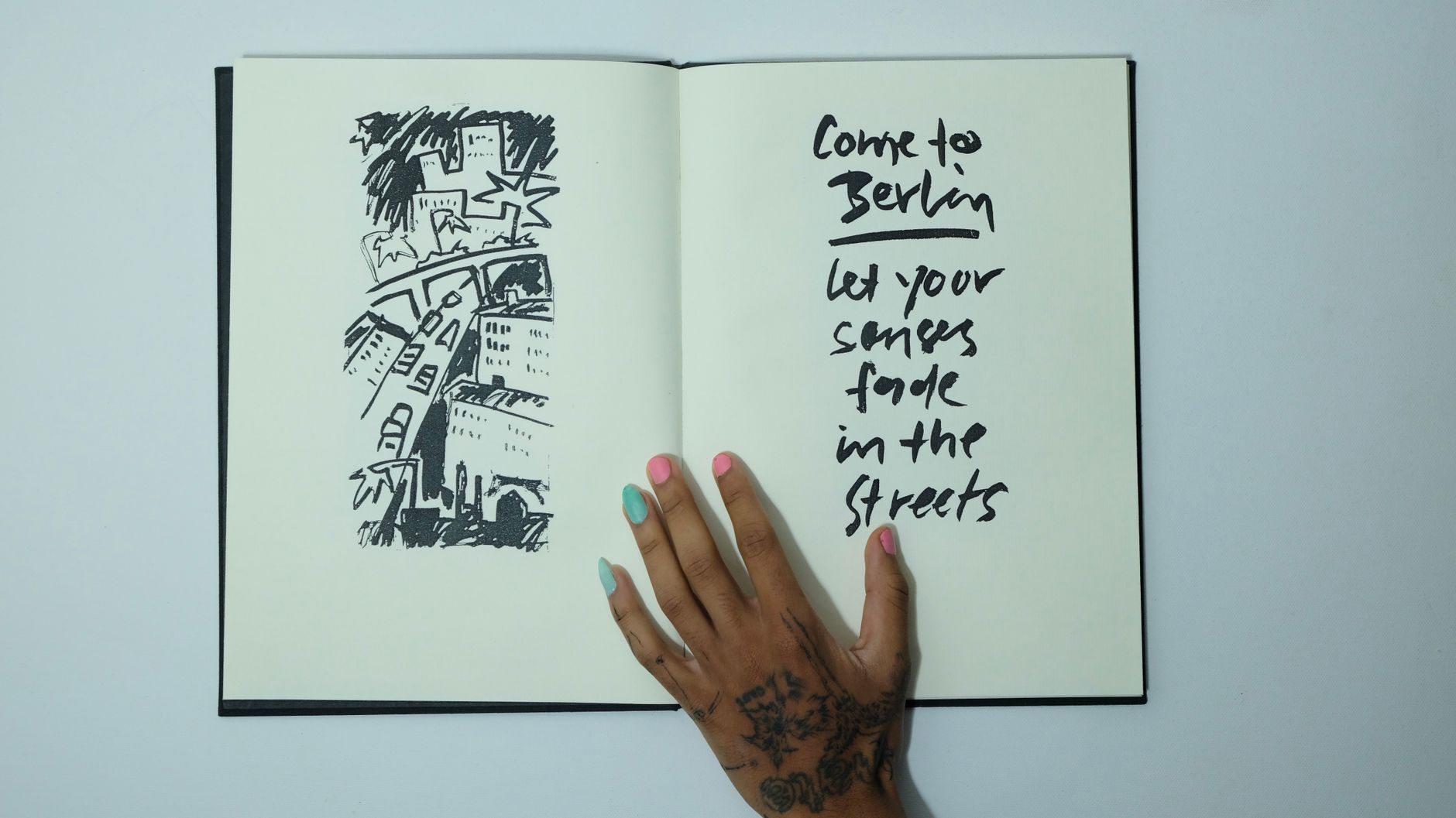 An open book displaying old, barely legible handwritten text on aged pages.